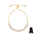 Detail van verstelbare gouden boxketting armband met zirkoon inleg en kleine bedeltjes - Stijl A-Rechthoekige Zirkoon