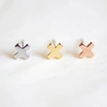 Detailed view of cross-shaped stud earrings in silver, gold, and rose gold finishes - Rose Gold