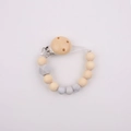 Detailed view of handmade silicone and wood baby pacifier clip with grey beads - Light Gray