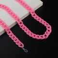 Close-up of pink acrylic chain link strap for glasses with metal ring and rubber loops - Watermelon red