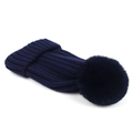 Detail of dark blue knit beanie featuring thick rib texture and fluffy faux fur pom-pom - Navy Blue
