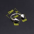 Macro detail of 10mm inner diameter stainless steel horseshoe ring with 4mm cone spikes - Circular Barbell/Spike/12mm
