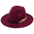 Close-up of wine red wool fedora hat with black band and gold leaf metal accessory - Burgundy
