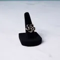 Vintage black enamel rose ring with crystal accents on a velvet finger display stand - Single Finger Square Base
