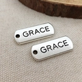 Set of two rectangular silver alloy charms engraved with GRACE for DIY jewelry making - Grace