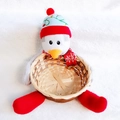 Close-up of a Christmas penguin storage basket made of woven bamboo and soft plush - Penguin Basket