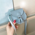 Mini grey-blue kids crossbody bag with cute tassel pendant and thin shoulder strap - Light Blue