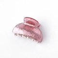 Close-up of a pink glitter acrylic hair claw clip with a durable silver metal spring - Round / Glitter Pink
