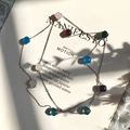 Long colorful faceted crystal stone necklace with golden chain on a magazine - Silver + Multicolor Mix 2