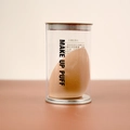 Esponja de maquillaje beige en forma de gota en un estuche cilíndrico transparente - Forma Gota de Agua (Empaque Cilindro) / Color Té con Leche