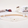 Adjustable thin white leather belt for dresses with a polished gold bow buckle - White Bow