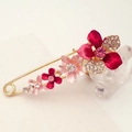 Floral pin brooch with red and pink petals and white rhinestones in gold finish - Red Bauhinia
