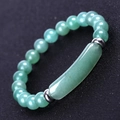Macro shot of green aventurine stone beads and curved tube bar on a beaded bracelet - Natural Green Aventurine (SL245A4704)