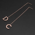 Rose gold chain tassel earrings featuring unique D and C letter pendants on dark background - Geometric CD Letter (8337)