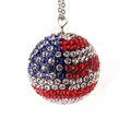 Macro shot of sparkling red white and blue rhinestone crystal car interior charm ball - USA Flag