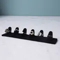 Elegant gold and silver rings collection on professional black velvet display stands - 6-Finger Slot