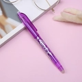 Purple erasable gel pen with white pattern and eraser tip on pink lifestyle background - 0.5mm / Purple