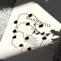 Collier élégant en chaîne dorée avec des perles de cristal noir facettées de style vintage - Or + Noir