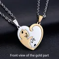 Detailed macro view of cat couple puzzle pendants in gold and silver finish with chain - Heart Splicing / Gold & Silver Cat (Pair + Chains)