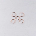 Detailed view of rose gold stainless steel jump rings for DIY jewelry making connections - 100 Pcs/Pack / Rose Gold
