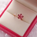 Macro detail of rose gold flower ring with pink crystals and zircon in a red gift box - 3#14116A (Rose Gold Red Gem Floral)