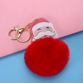 Christmas Santa Claus keychain with large red plush ball and golden metal clasp on a dual-tone background - Lobster Clasp Style