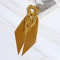 Ginger yellow corduroy bow scrunchie with long ribbons on white marble background - Turmeric