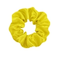 Close-up of bright yellow satin scrunchie showing glossy texture and elastic fabric detail - Yellow