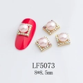 Macro detail of pink pearl nail charm with gold frame and rhinestones, size 8x8.5mm - 5073 Light Pink Pearl Iridescent Frame Style