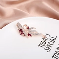Elegant rose gold flower brooch featuring burgundy teardrop crystals and pavé diamonds - Wine Red Ribbon