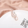 Spilla chiave di violino in oro rosa con strass bianchi e cristalli su porcellana - Chiave di Violino Oro Rosa