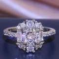 Luxurious silver ring featuring round and rectangular claw-set cubic zirconia stones - US 10 / White