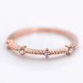 Elegant rose gold ring featuring four tiny diamonds and vintage milgrain texture band - US 9 / Gold