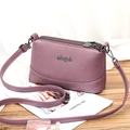 Purple lychee grain soft leather triple zipper shoulder bag for women with metal logo - Purple