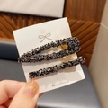 Set de 2 pinzas doradas para el pelo con cristales negros brillantes en tarjeta blanca - Negro Plata