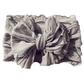 Close-up of a grey layered lace bow headband for babies with delicate pleated fabric texture - Gray