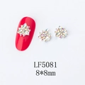 Detail view of 8x8mm AB floral nail art charms with silver metal frame on red nail - 5081 Iridescent White