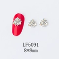 Detailed view of 8x8mm floral 3D nail art charm with rhinestones for manicure - 5091 Iridescent White