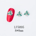 Green and white crystal flower nail art charms 8x8mm size shown on a red nail - 5095 Peacock Green