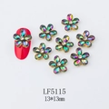 Macro detail of 13x13mm gold floral nail art charms with AB rhinestones on red nails - 5115 Multicolor