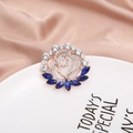 Exquisite rose gold flower brooch with navy blue gems and zircon on champagne silk - Blue Spiral Flower