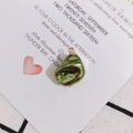 Close-up of olive green baroque pearl pendant with gold plating for DIY jewelry making - Green