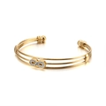 Brazalete abierto de capas doradas con símbolo de infinito y cristales blancos brillantes - Dorado