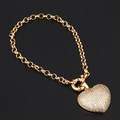 Armband im südamerikanischen Stil mit goldenem Herzanhänger und Zirkonia auf schwarzem Grund - Weißer Zirkon