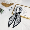 Silk scarf with black and white tropical elephant print styled on a straw hat - Black Edge Tropical