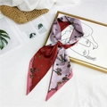 Two-tone floral silk scarf in burgundy and mauve pink, displayed on a stylized straw bag - Red Purple Double Floral