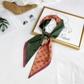 Long silk scarf in dark green and orange with horse pattern tied on elegant frame - Green Orange Horse Block