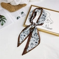 Silk-feel neck scarf featuring camel and floral prints with brown borders on white background - White Brown Tropical