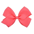 Macro detail of large grosgrain ribbon hair bow in vibrant coral pink with textured ribs - Coral Pink