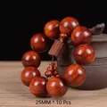 Macro detail of 25mm sandalwood beads with golden star patterns and wooden pendant - Premium Square Plate Accessory Style / 25mm*10 Beads